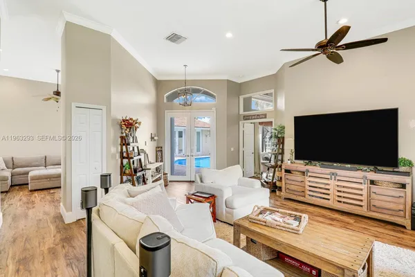 a living room with furniture and a flat screen tv