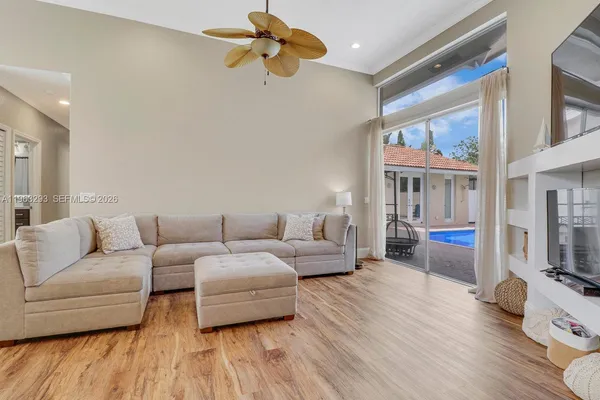 a living room with furniture and a flat screen tv