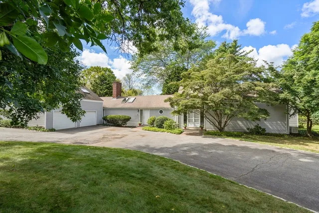 a view of a house with a yard and garage