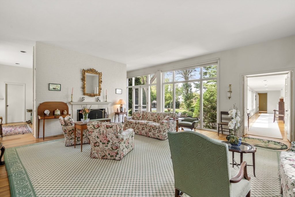 3 Proctor Street Manchester, MA 01944 - Photo 15 of 41 a living room with furniture fireplace and large windows
