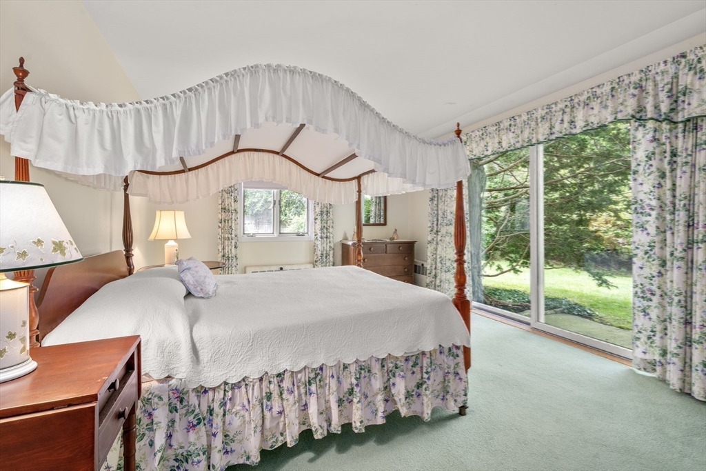 3 Proctor Street Manchester, MA 01944 - Photo 27 of 41 a bedroom with a large bed and a large window