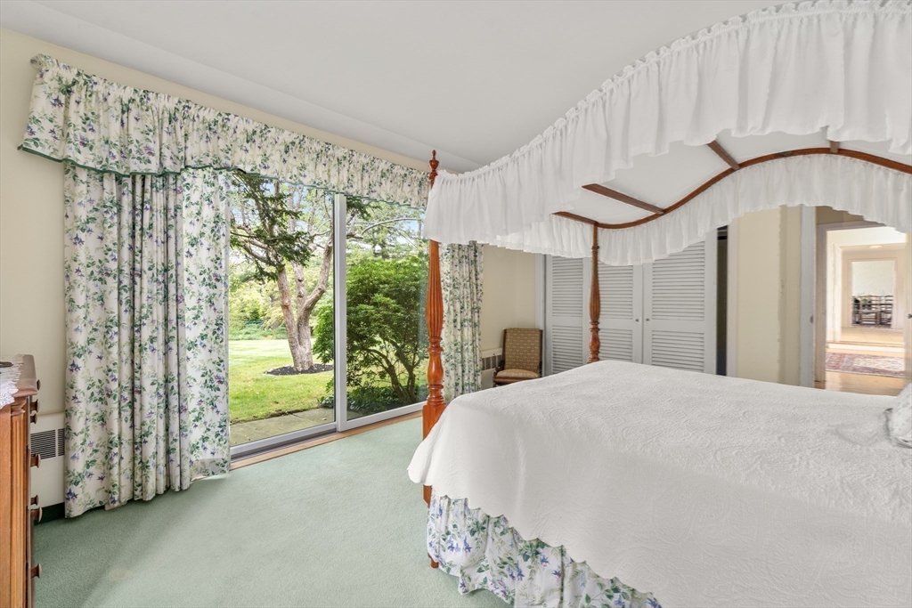 3 Proctor Street Manchester, MA 01944 - Photo 28 of 41 a large white bed sitting in a bedroom next to a window