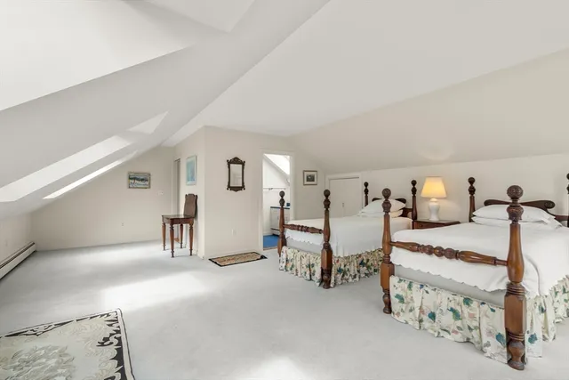 a bedroom with bed and window