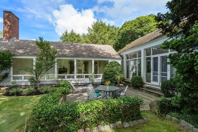 a view of house with a yard and garden