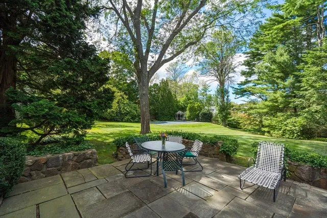 a view of a table and chairs in the garden