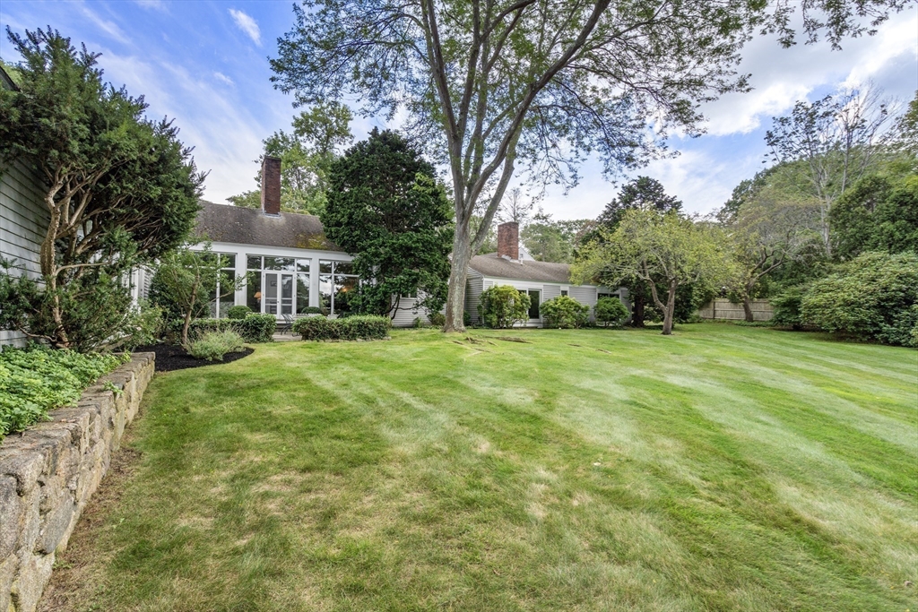 3 Proctor Street Manchester, MA 01944 - Photo 7 of 41 a view of a house with a big yard and large trees