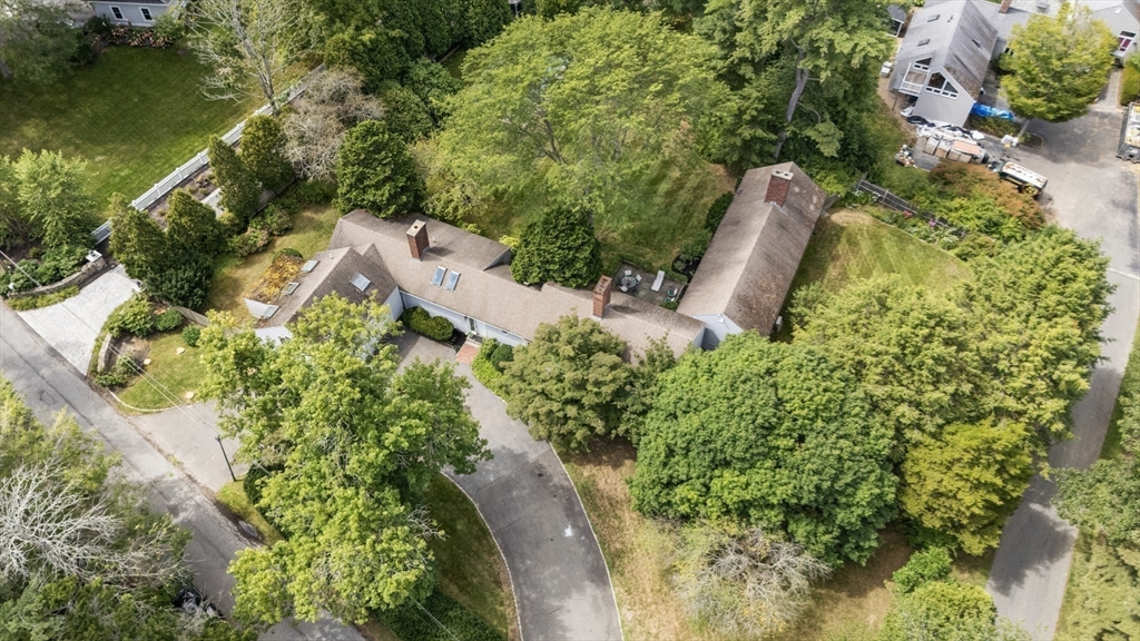 3 Proctor Street Manchester, MA 01944 - Photo 9 of 41 an aerial view of a house with a yard and lake view
