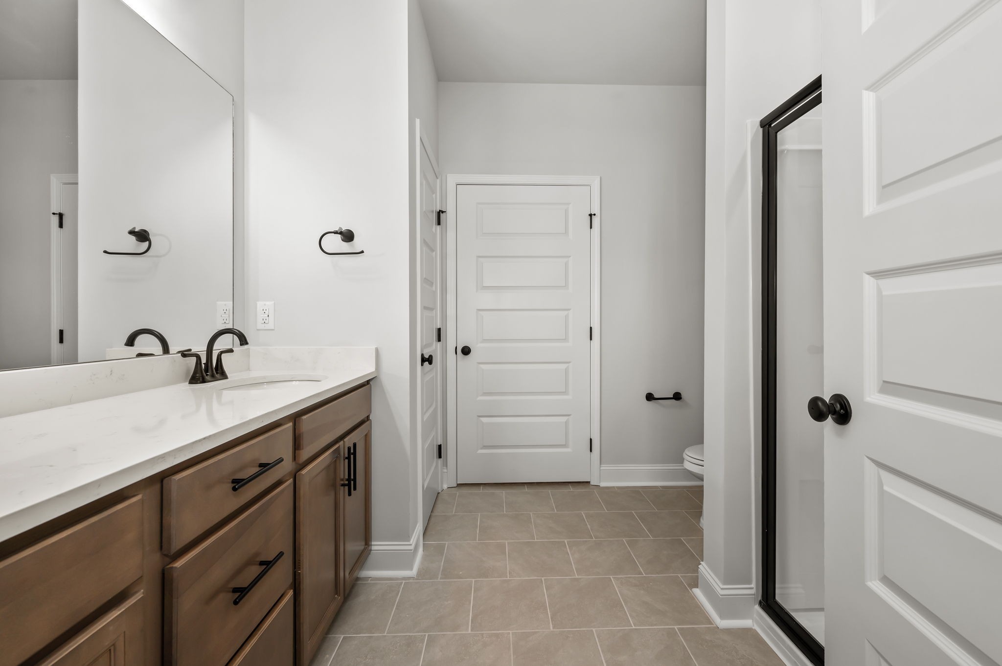 522 Rohan Drive Murfreesboro, TN 37129 - Photo 13 of 33 a spacious bathroom with a shower sink and mirror