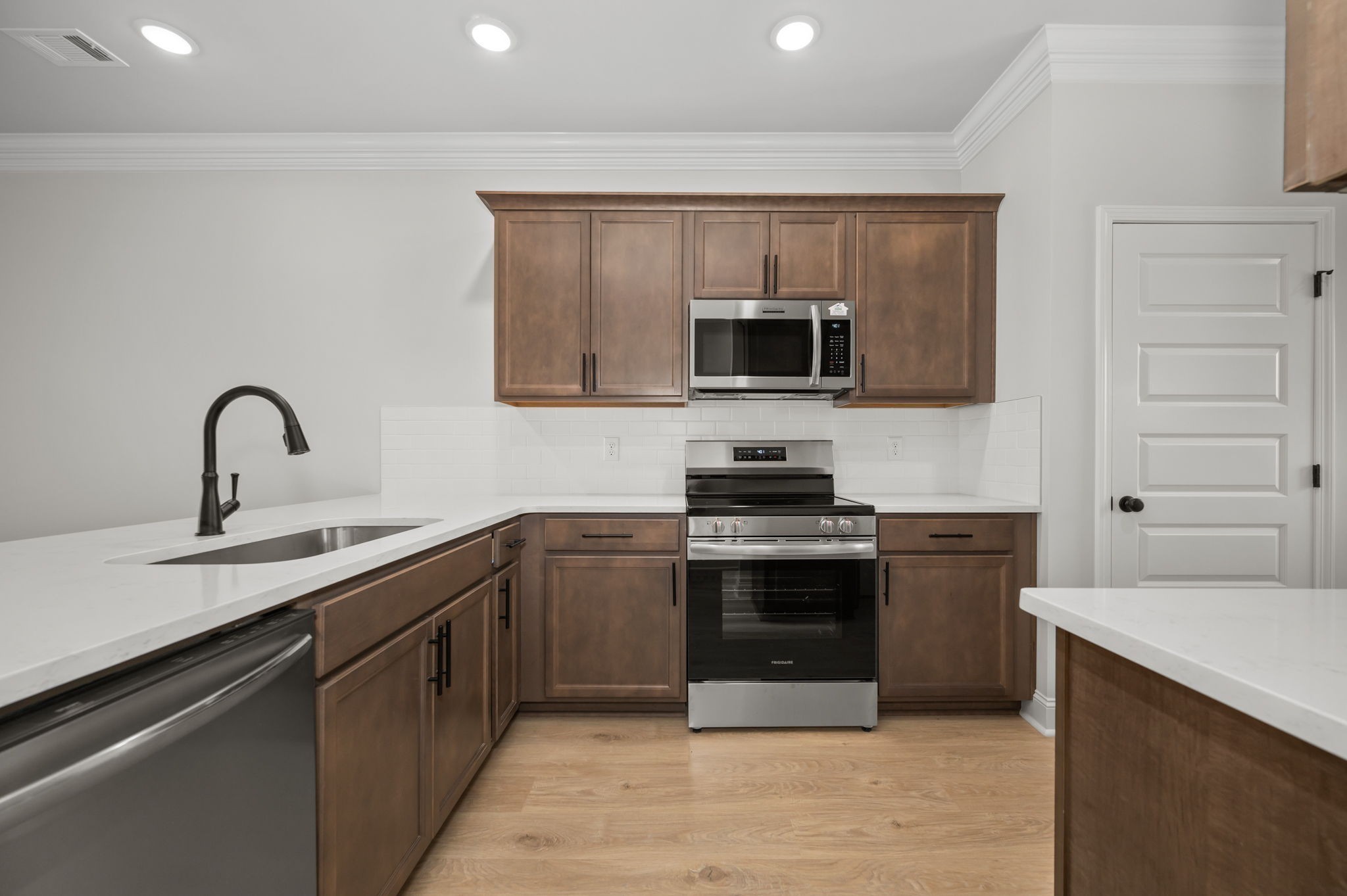 522 Rohan Drive Murfreesboro, TN 37129 - Photo 5 of 33 a kitchen with stainless steel appliances a stove sink and microwave