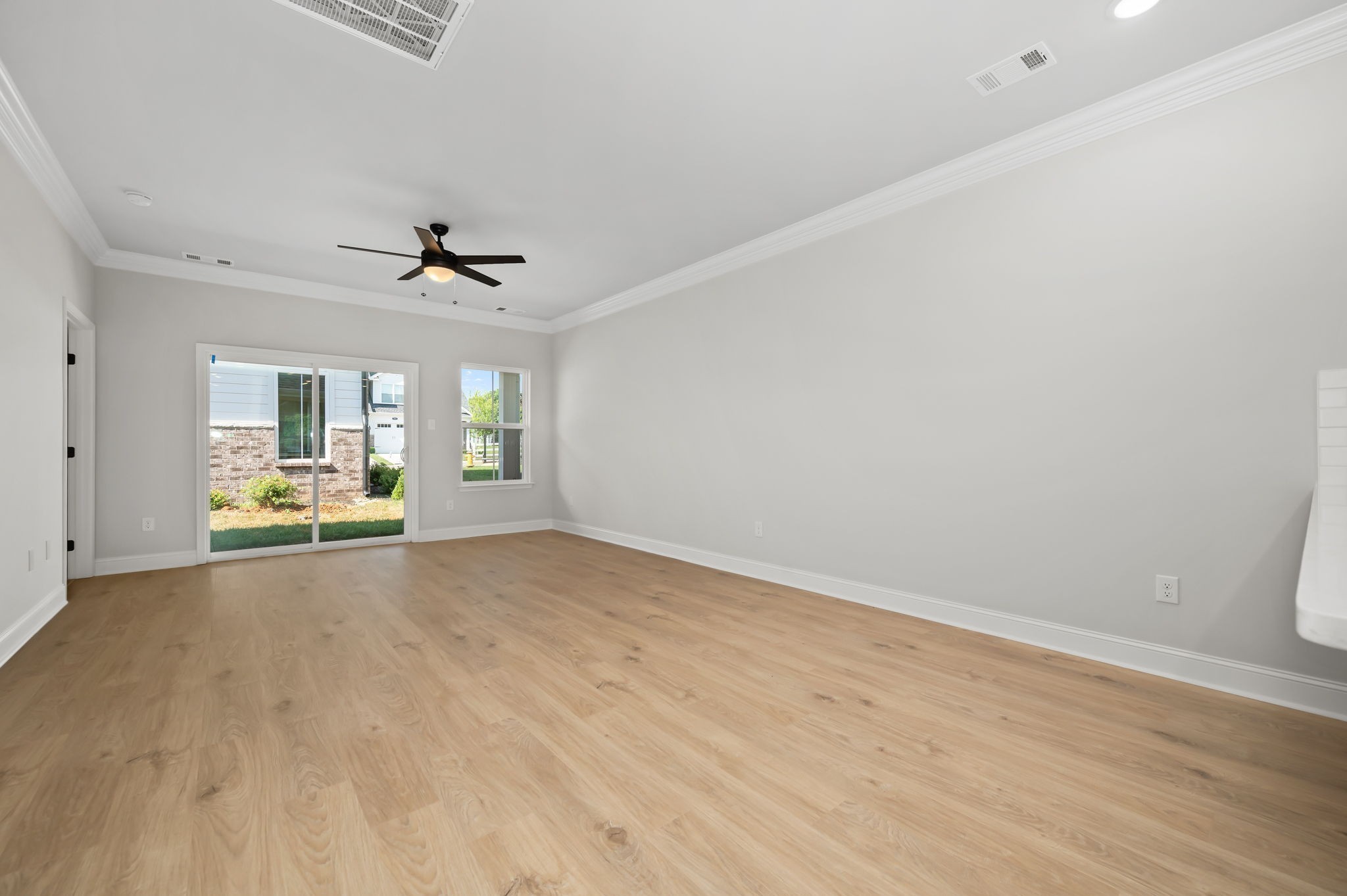 522 Rohan Drive Murfreesboro, TN 37129 - Photo 7 of 33 wooden floor in an empty room with a window