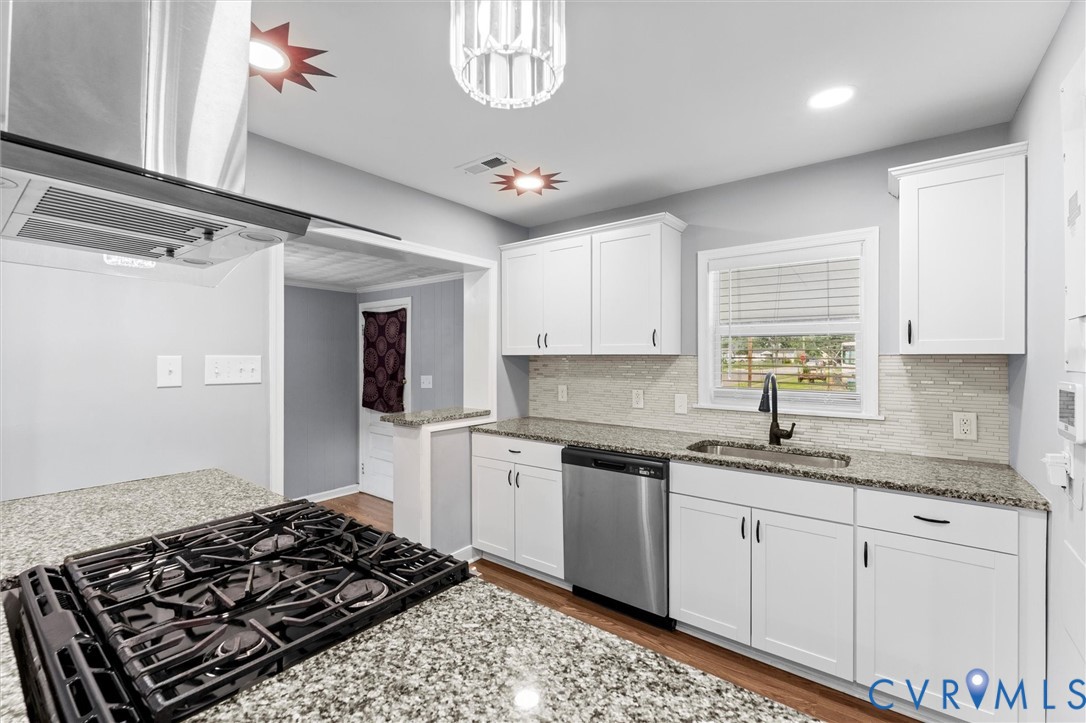 3424 Danbury Road Richmond, VA 23234 - Photo 11 of 37 Kitchen with white cabinets, light stone counterto