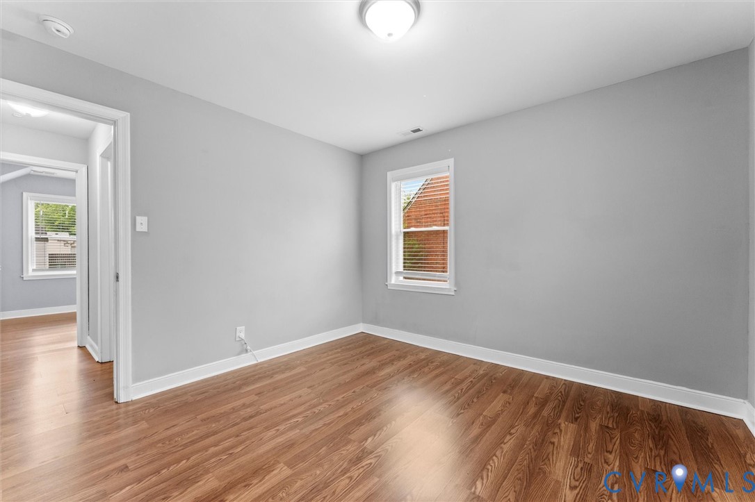 3424 Danbury Road Richmond, VA 23234 - Photo 18 of 37 Empty room with wood finished floors and plenty of