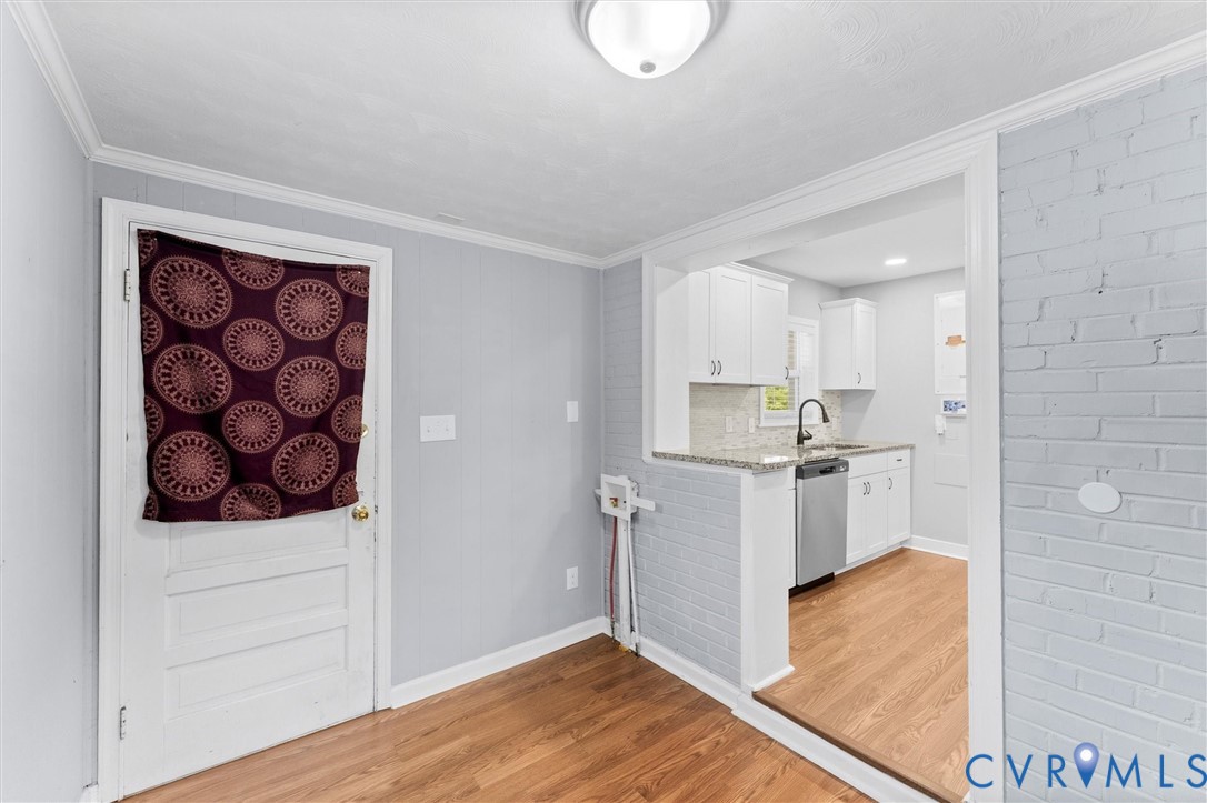 3424 Danbury Road Richmond, VA 23234 - Photo 22 of 37 Kitchen featuring crown molding, light wood-style