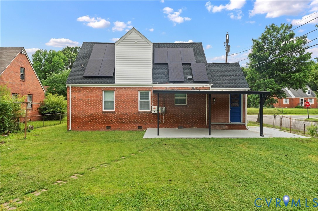 3424 Danbury Road Richmond, VA 23234 - Photo 33 of 37 Back of house with solar panels, a fenced backyard