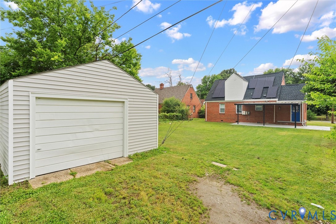 3424 Danbury Road Richmond, VA 23234 - Photo 34 of 37 View of green lawn with an outdoor structure, a pa