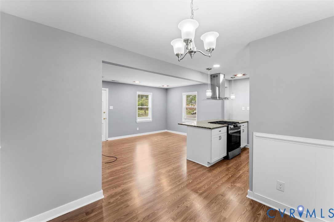 3424 Danbury Road Richmond, VA 23234 - Photo 9 of 37 Kitchen with white cabinets, stainless steel range