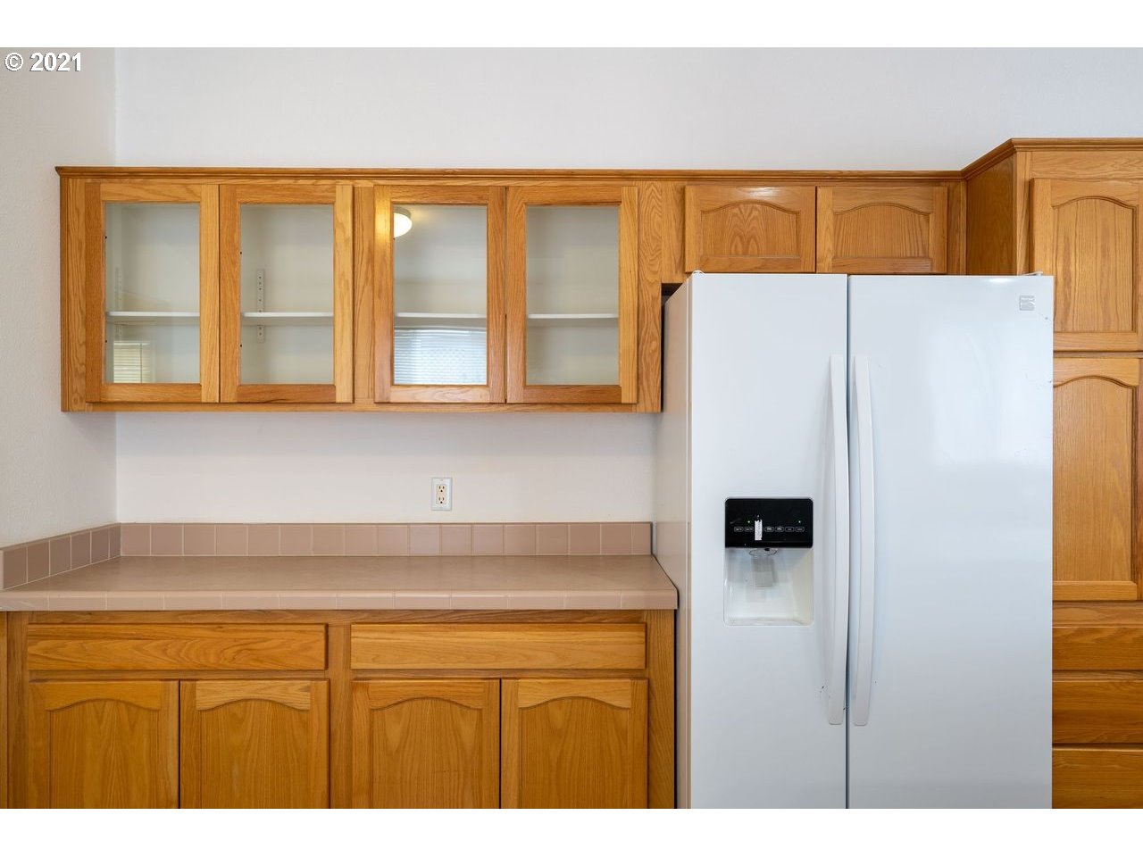 2525 Maia Loop Springfield, OR 97477 - Photo 11 of 27 a kitchen with a refrigerator and a cabinets