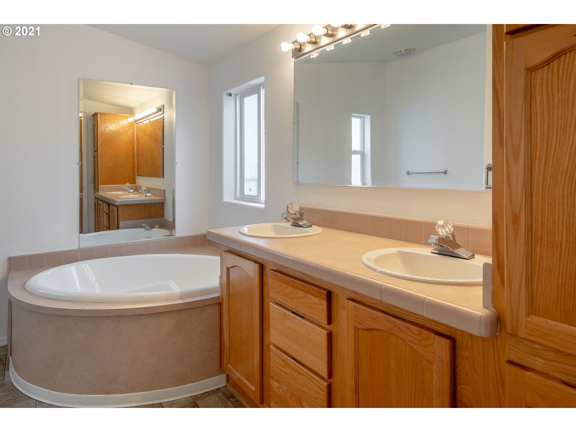 2525 Maia Loop Springfield, OR 97477 - Photo 18 of 27 a bathroom with a sink a toilet and mirror