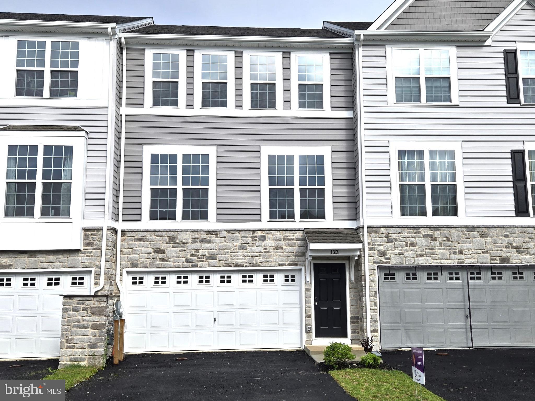 a front view of a building with glass windows