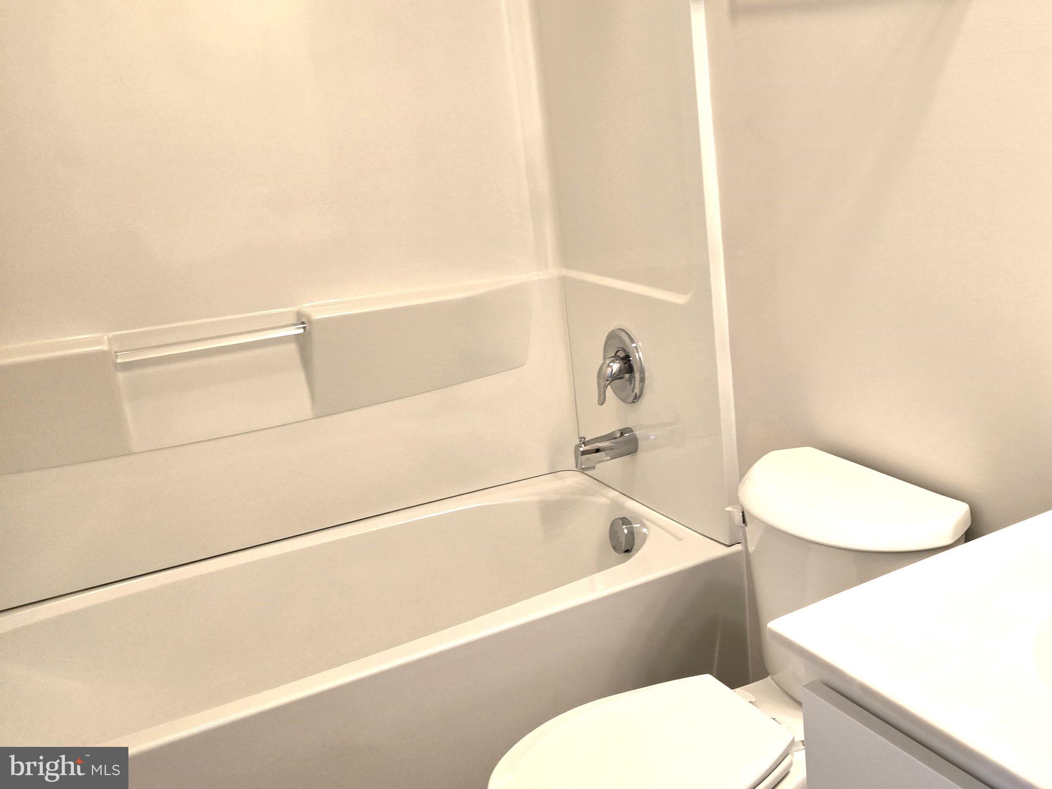 123 Case Road Townsend, DE 19734 - Photo 19 of 22 a bathroom with a toilet and a bathtub