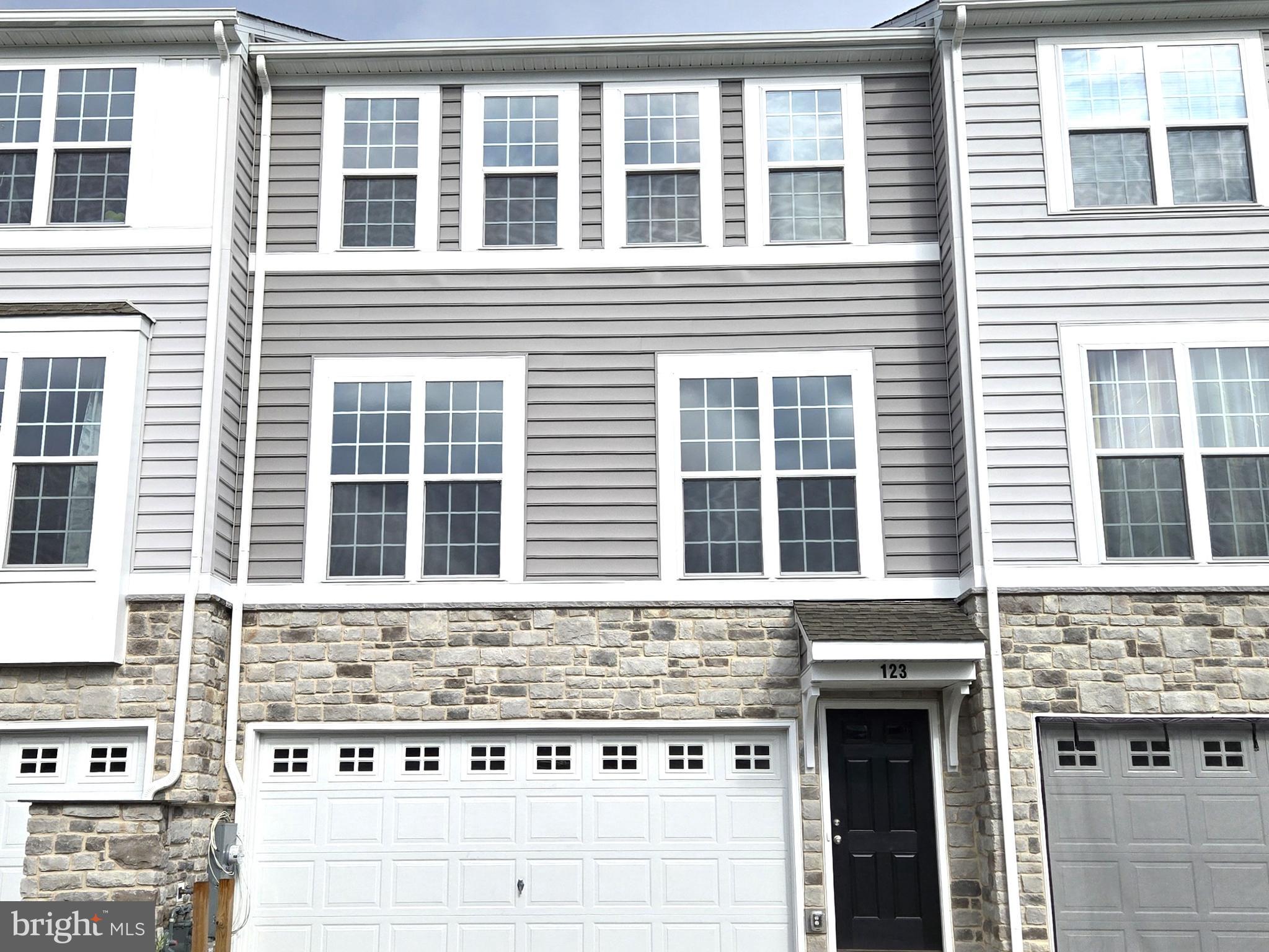 123 Case Road Townsend, DE 19734 - Photo 2 of 22 a front view of a building with a entrance