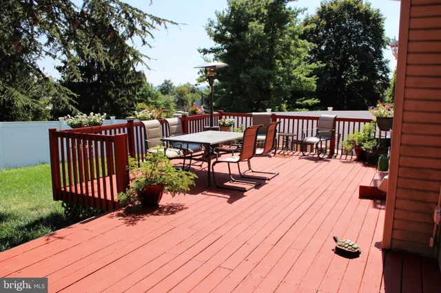 a view of a wooden deck with furniture
