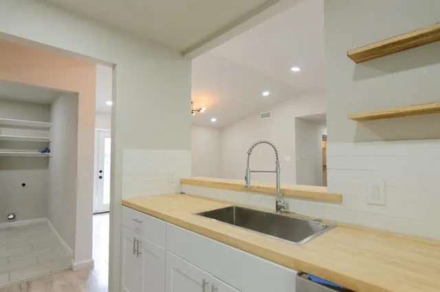 a close view of a sink and a kitchen with a sink