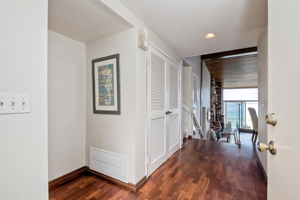 1808 Parliament Road Encinitas, CA 92024 - Photo 13 of 49 a view of a hallway with wooden floor and closet