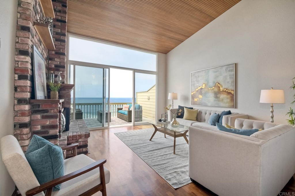 1808 Parliament Road Encinitas, CA 92024 - Photo 15 of 49 a living room with furniture and a large window
