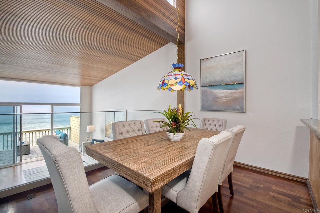 1808 Parliament Road Encinitas, CA 92024 - Photo 18 of 49 a dining room with furniture and wooden floor