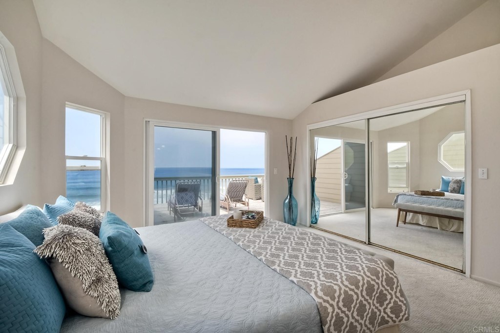 1808 Parliament Road Encinitas, CA 92024 - Photo 22 of 49 a bedroom with a large bed and a large window with outer view