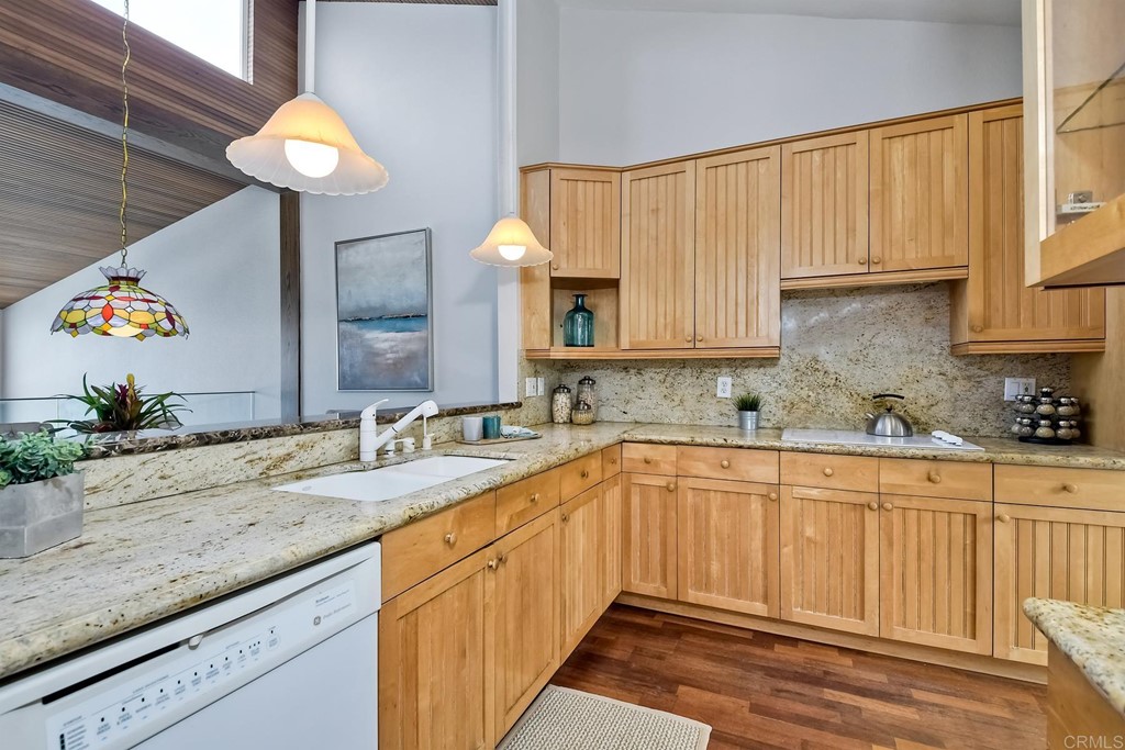 1808 Parliament Road Encinitas, CA 92024 - Photo 27 of 49 a kitchen with a sink cabinets and wooden floor