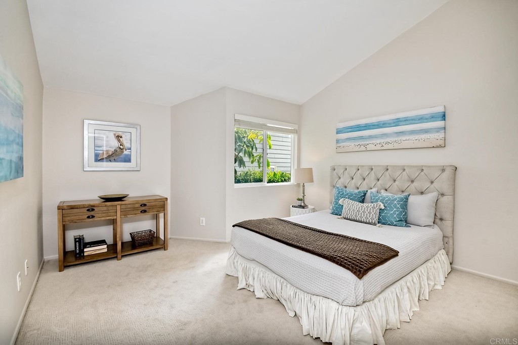 1808 Parliament Road Encinitas, CA 92024 - Photo 29 of 49 a bedroom with a bed and a couch