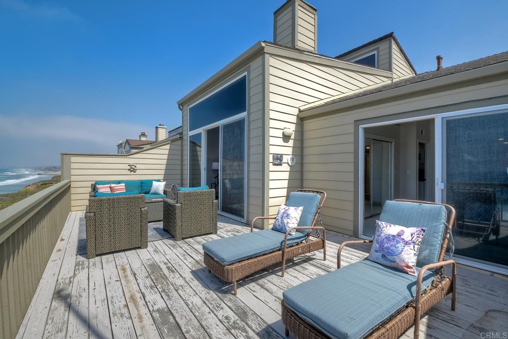 1808 Parliament Road Encinitas, CA 92024 - Photo 37 of 49 a living room with furniture and a wooden floor
