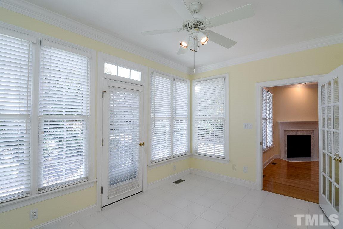 3504 Proprietor Way Raleigh, NC 27612 - Photo 13 of 25 a view of an empty room with a fireplace and a window