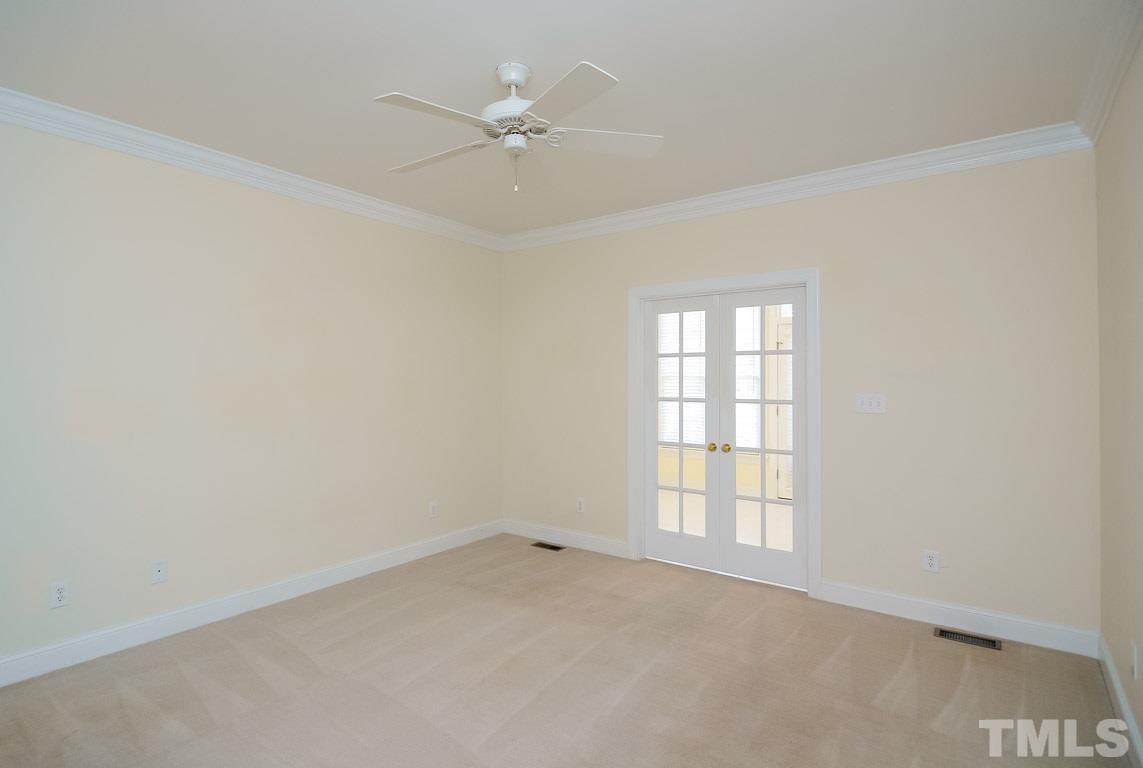 3504 Proprietor Way Raleigh, NC 27612 - Photo 14 of 25 an empty room with windows and fan
