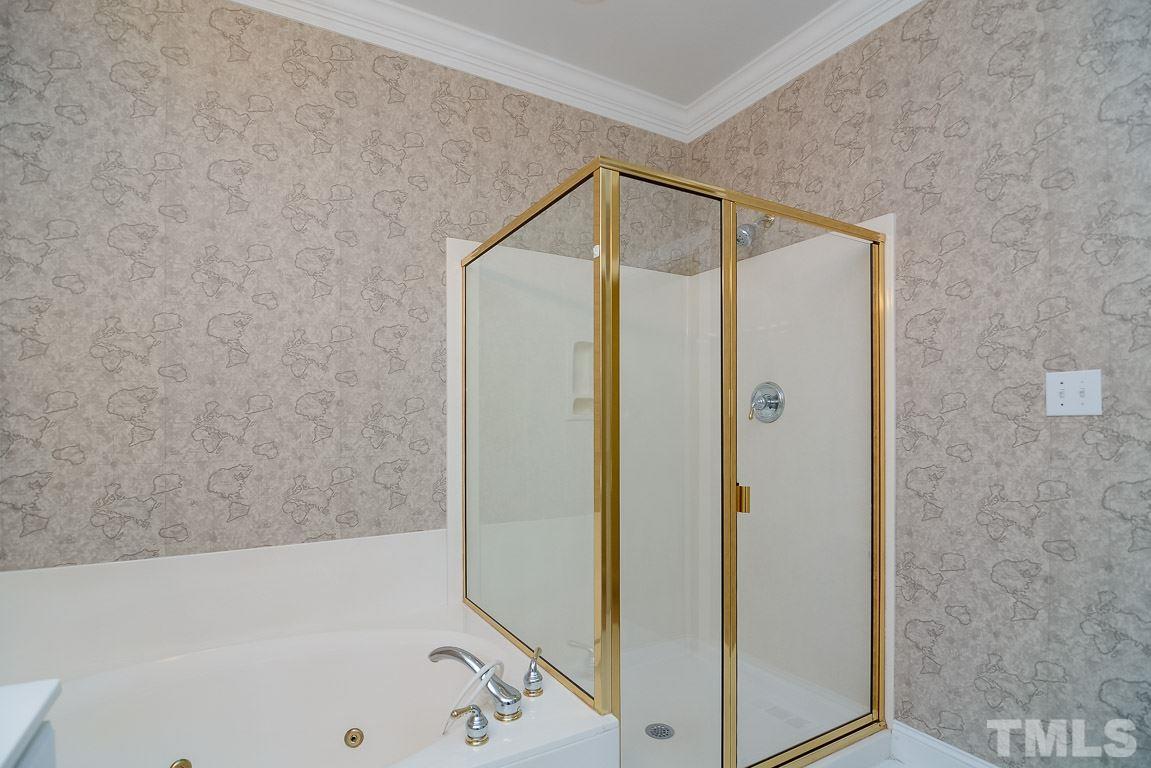 3504 Proprietor Way Raleigh, NC 27612 - Photo 24 of 25 a bathroom with a bathtub and a shower