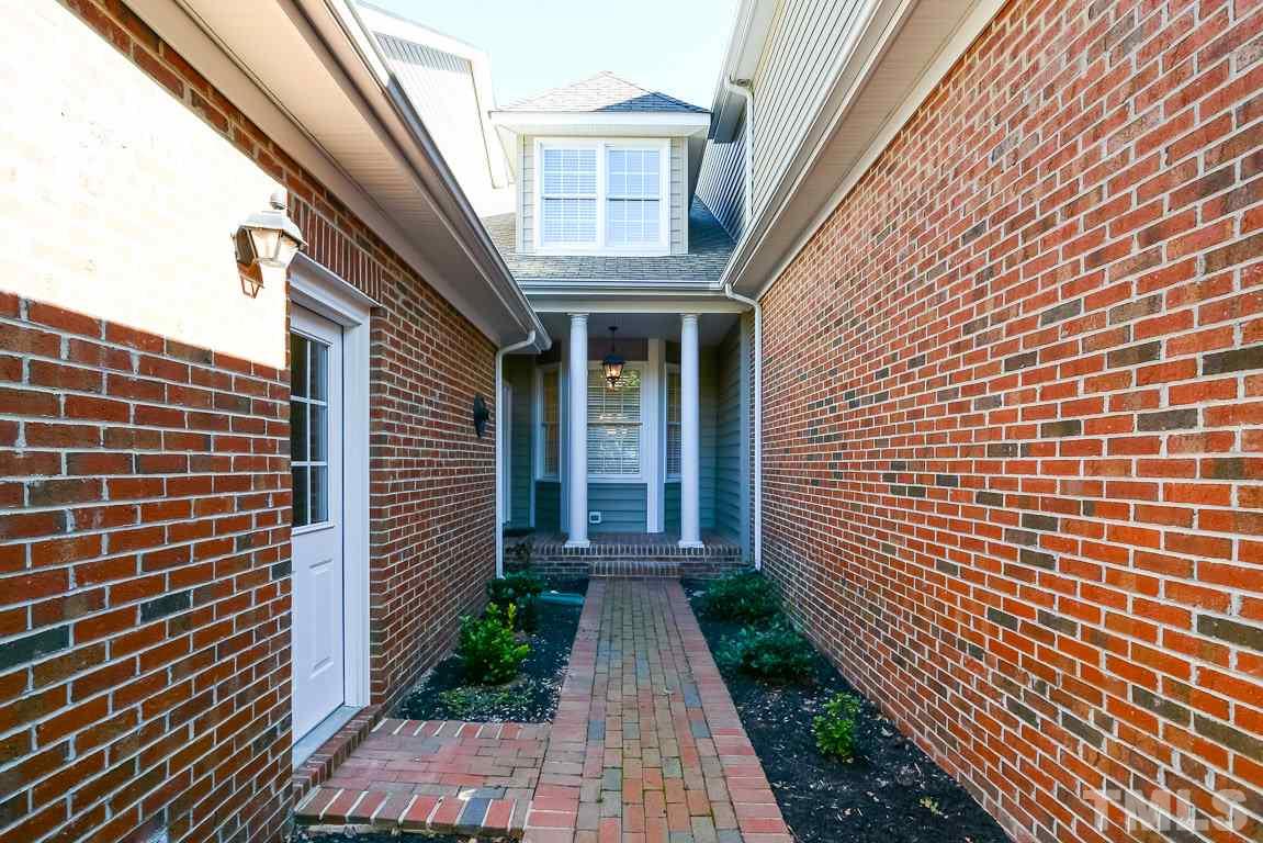 3504 Proprietor Way Raleigh, NC 27612 - Photo 25 of 25 a view of a brick house with many windows