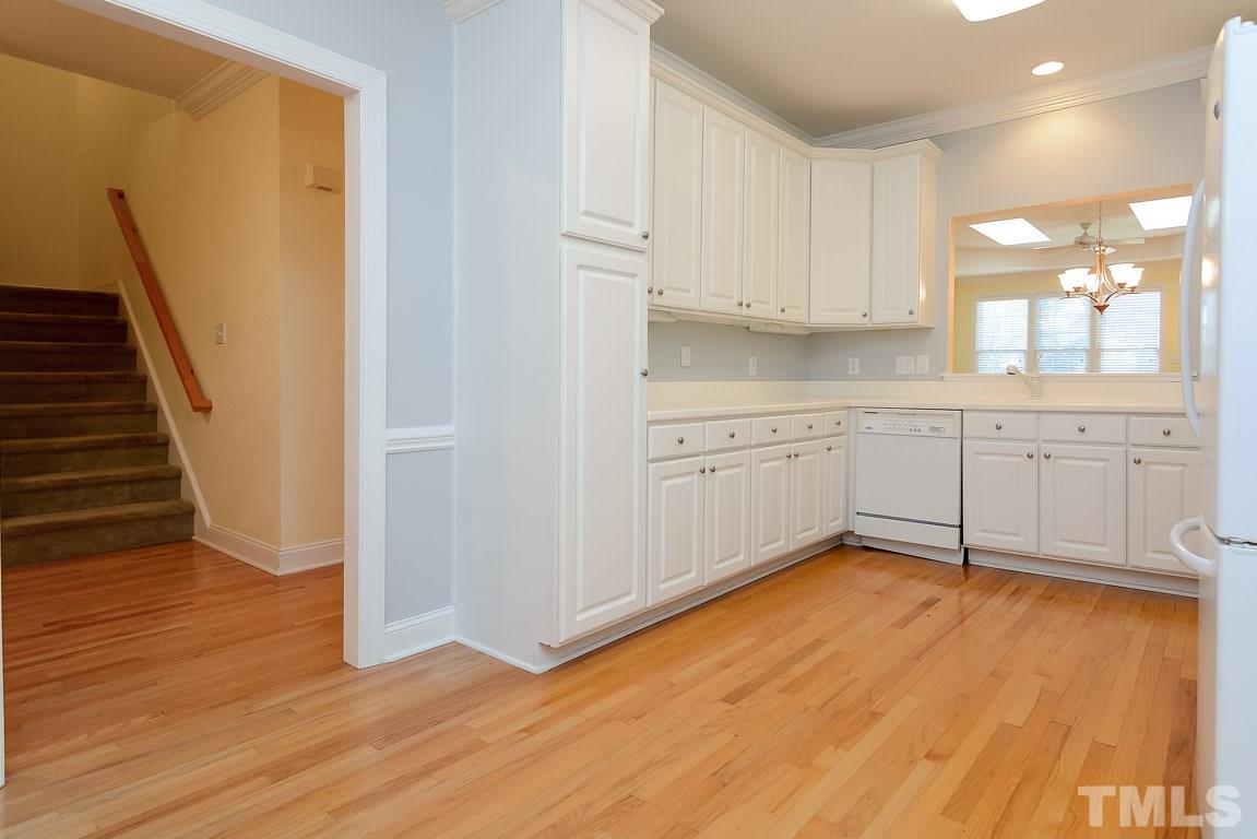 3504 Proprietor Way Raleigh, NC 27612 - Photo 6 of 25 a view of a kitchen with wooden floor and electronic appliances