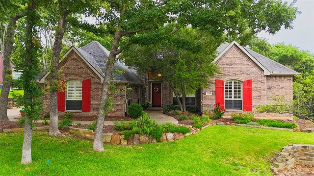 a front view of house with yard and outdoor seating