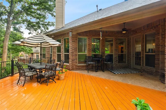 a patio with table and chairs