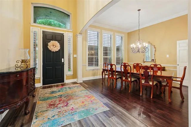 a dining hall with furniture window and wooden floor