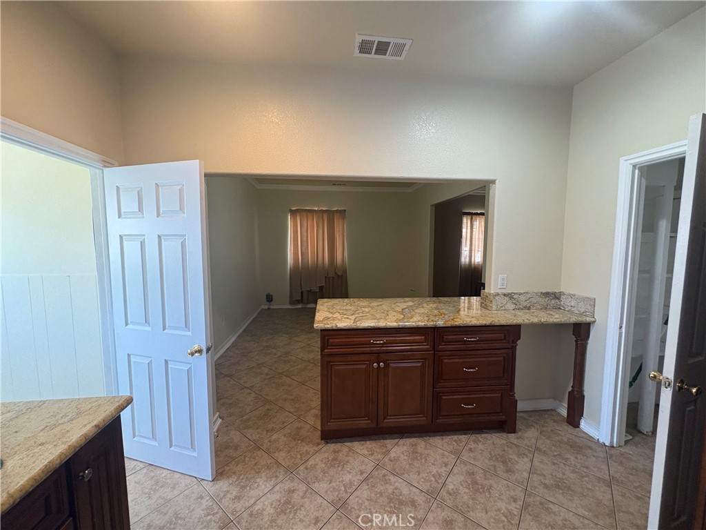 3395 Franklin Avenue Riverside, CA 92507 - Photo 15 of 55 a spacious bathroom with a granite countertop sink and a mirror