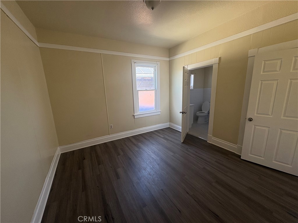 3395 Franklin Avenue Riverside, CA 92507 - Photo 27 of 55 an empty room with wooden floor and window