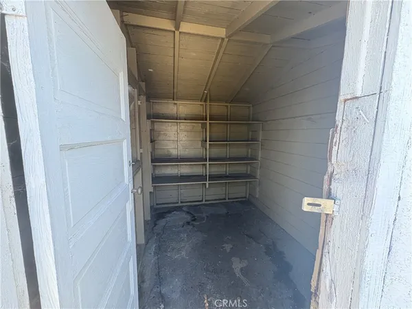 a front view of a house with parking area