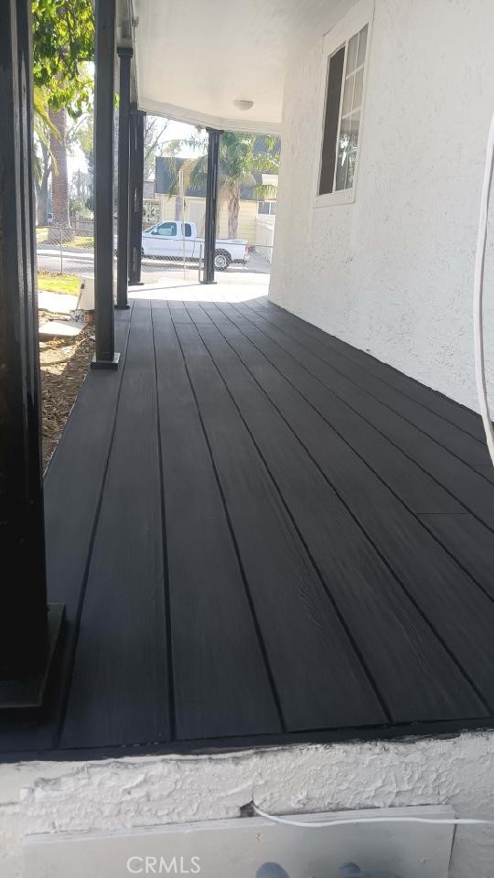 3395 Franklin Avenue Riverside, CA 92507 - Photo 52 of 55 a view of a room with wooden floor and a floor to ceiling window
