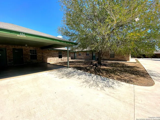 a view of a backyard of the house