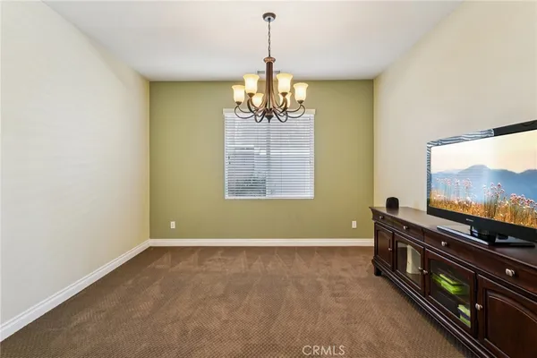 a room with window and flat screen tv