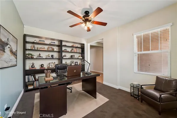 a work room with furniture and windows