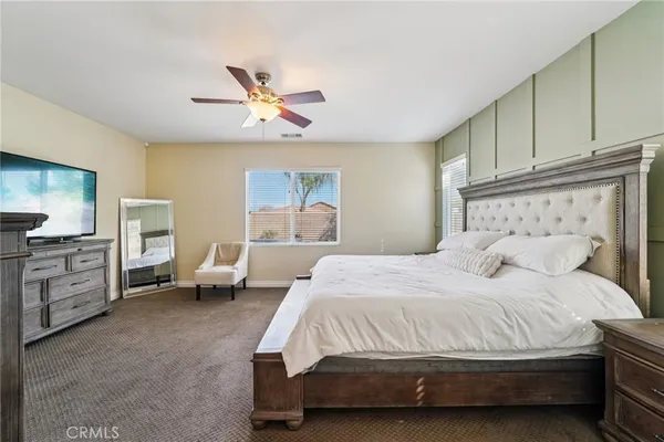 a bedroom with a bed and furniture